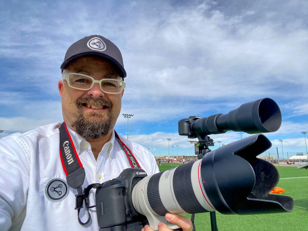 Ira Bowman with Canon Cameras out on Field in Mesa, AZ.